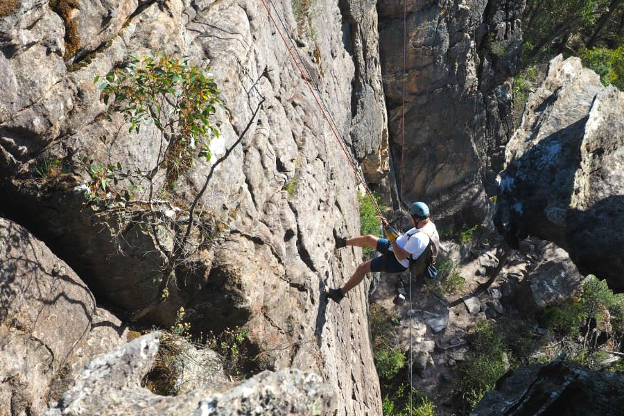 Abseiling the 20 m drop before climbing back up!